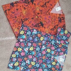 TWO holiday scrub tops